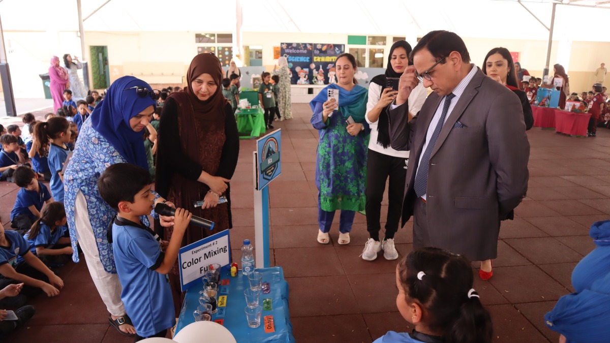  A student explaining his project to officials.
