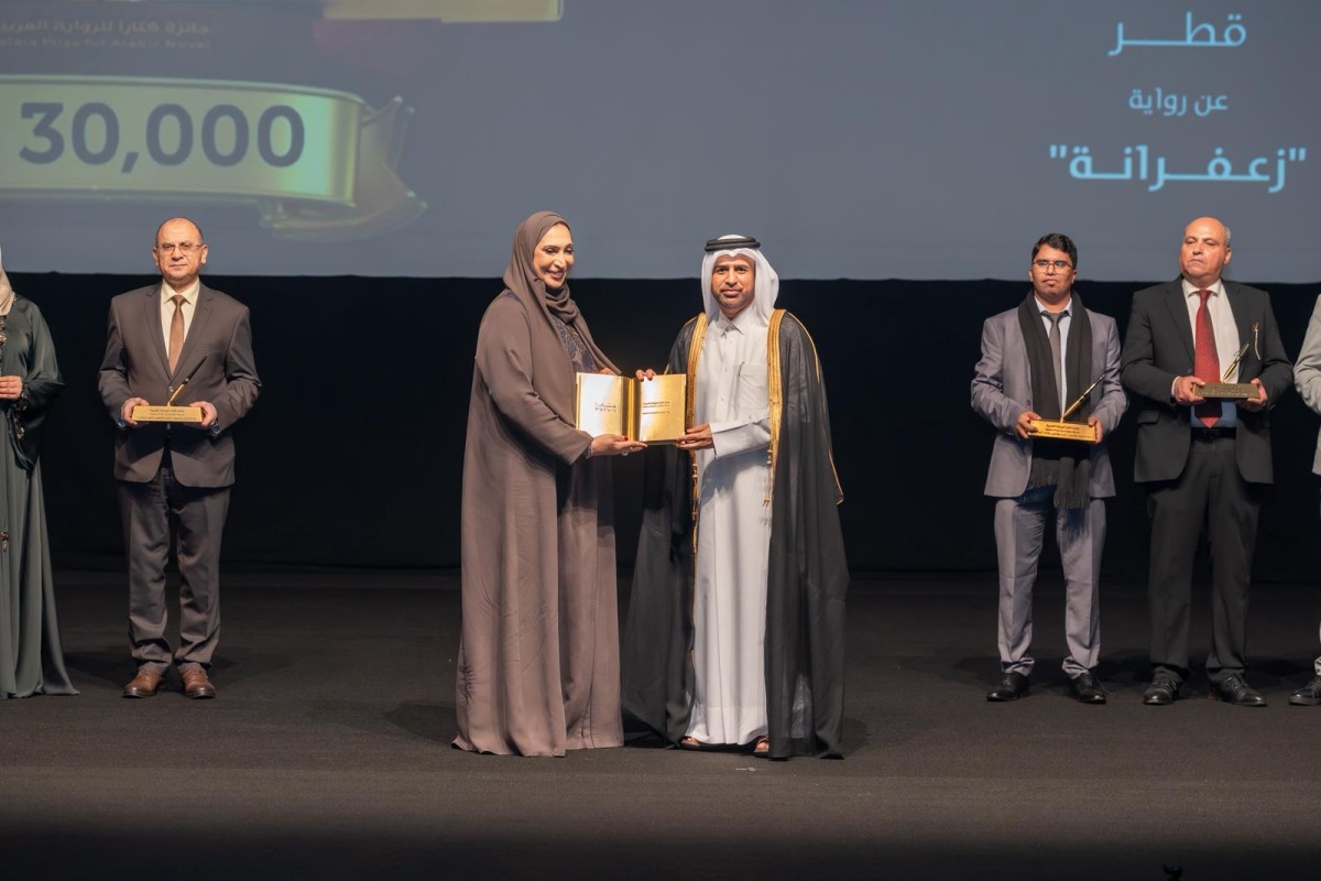 General Manager of the Cultural Village Foundation - Katara Prof. Dr. Khalid bin Ibrahim Al-Sulaiti honouring a winner of the 11th Katara Prize for Arabic Novel 2025 at a ceremony at the Katara Opera House yesterday.