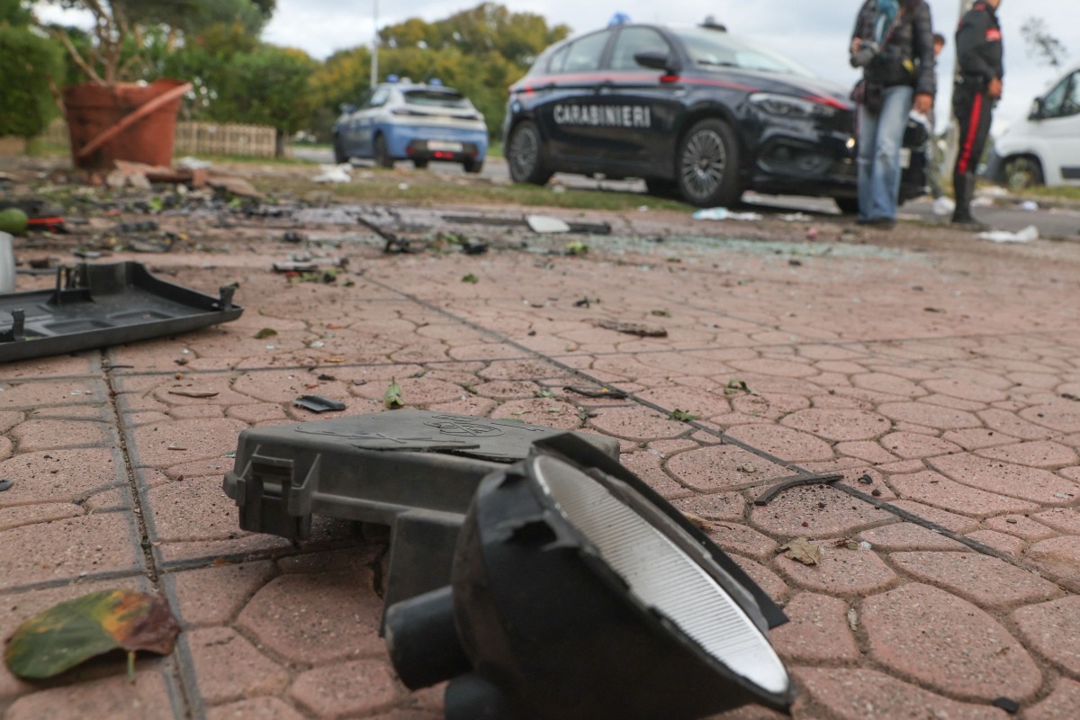 Italian Carabinieri stand guard in front of the residence of Italian journalist of TV investigative television news show 'Report', Sigfrido Ranucci, after a bomb destroyed vehicles parked in front of his house in Pomezia near Rome, on 17 October 2025. Photo by Emanuele VALERI / ANSA / AFP