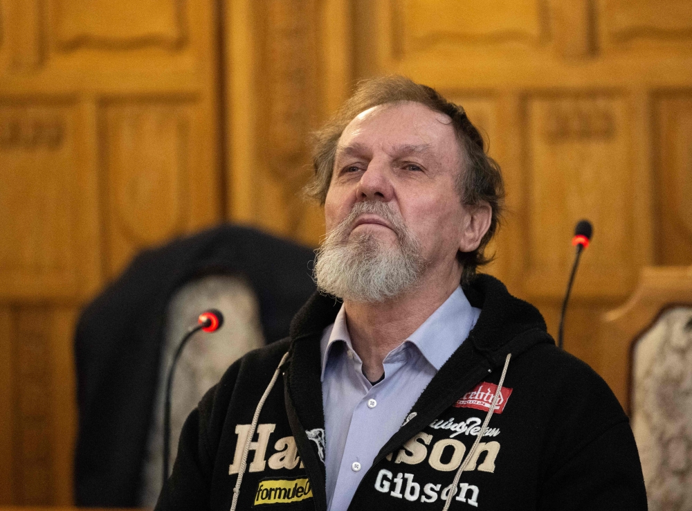 72-year-old Juraj Cintula stands in the court room in Banska Bystrica, central Slovakia, on October 21, 2025. Photo by Joe Klamar / AFP