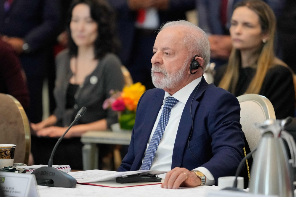 Brazil's President Luiz Inacio Lula da Silva attends a meeting with Malaysia's Prime Minister Anwar Ibrahim at the official residence of the prime minister in Putrajaya, outside Kuala Lumpur on October 25, 2025. (Photo by Vincent Thian / POOL / AFP)