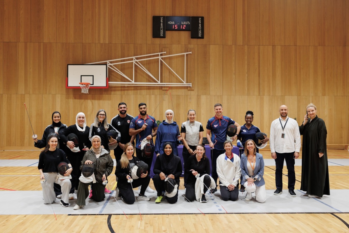 Participants of the workshop with Olympic medallist Ibtihaj Muhammad.