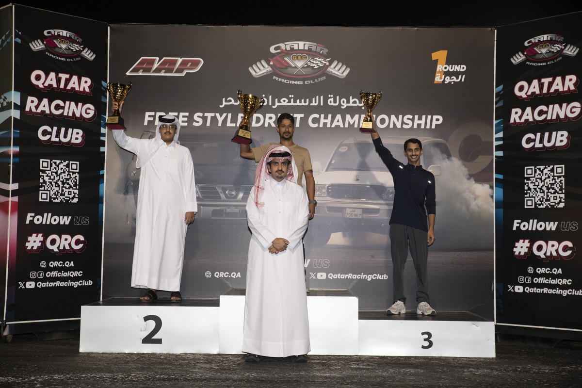 Qatar Racing Club's Director General Sheikh Jabor bin Khalid Al Thani poses for a photo with the podium winners.