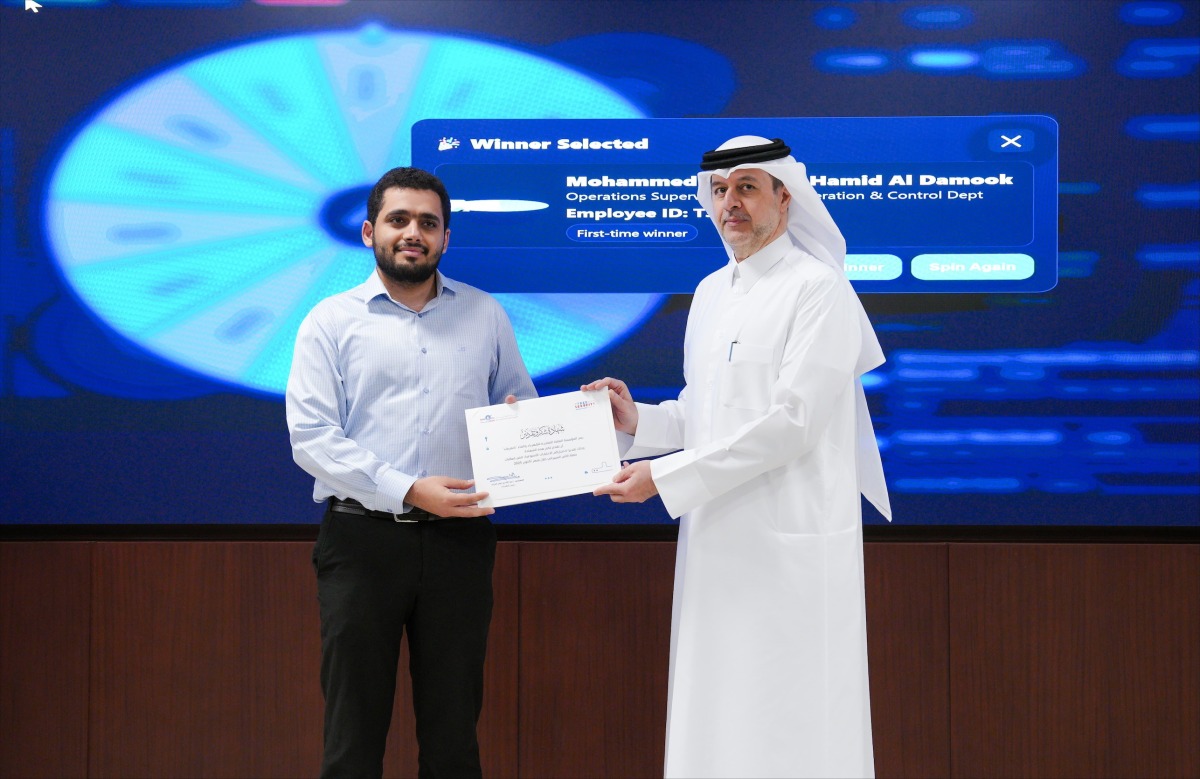 President of Kahramaa H E Eng. Abdulla bin Ali Al-Theyab presenting appreciation certificate to a participant.