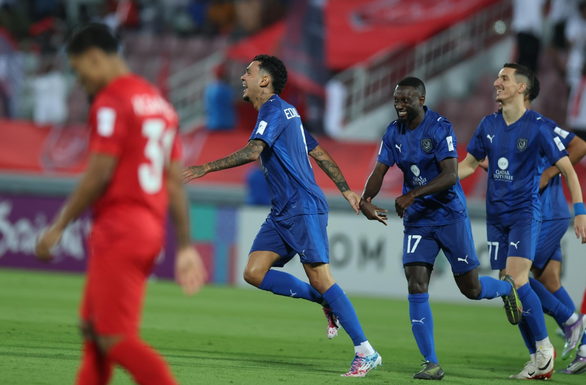 Al Duhail's Edmilson Junior (second left) celebrates after scoring team's first goal. 