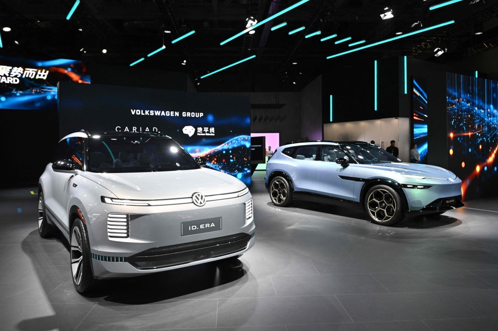 Photo representation of Volkswagen brand as seen at the 8th China International Import Expo (CIIE) in Shanghai. Photo by Hector Retamal / AFP