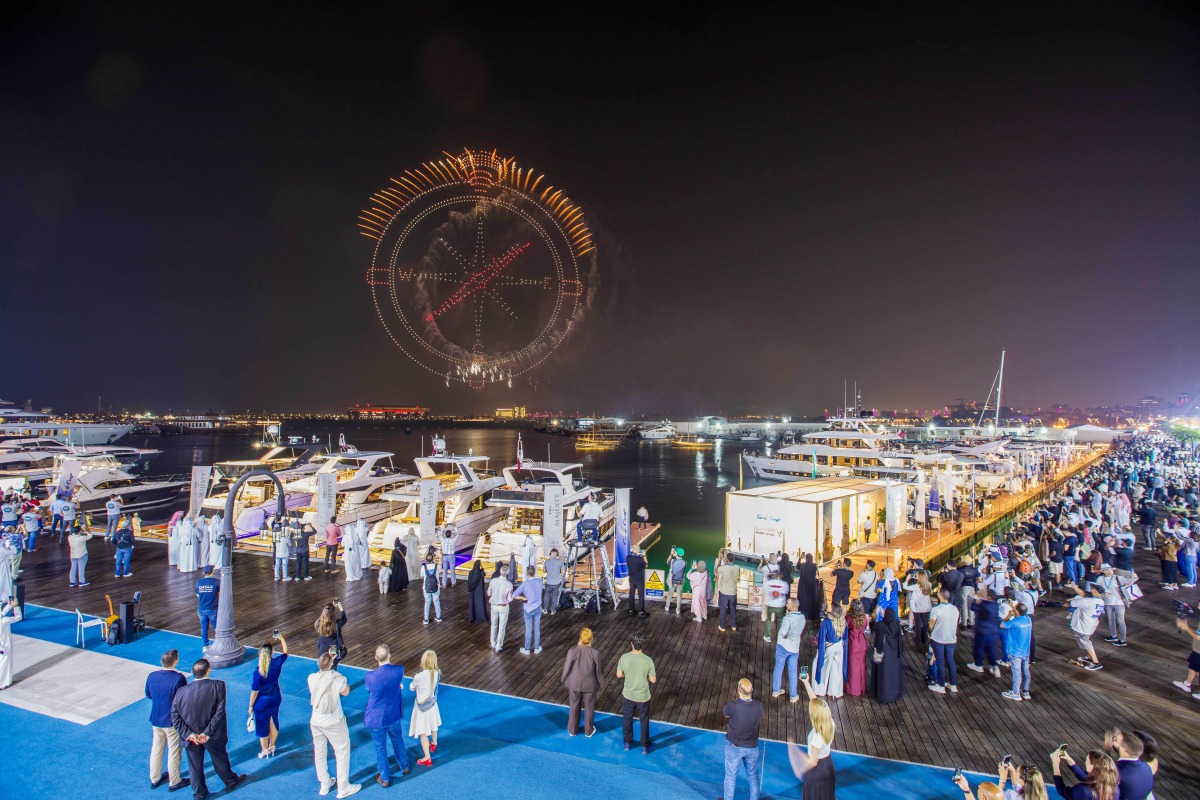 People enjoying fireworks during the opening of the Qatar Boat Show 2025.