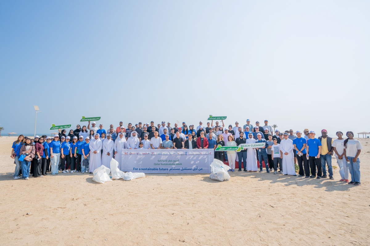 UDST President Dr. Salem Al-Naemi with staff and students during the beach cleanup initiative at Al Wakrah Public Beach.