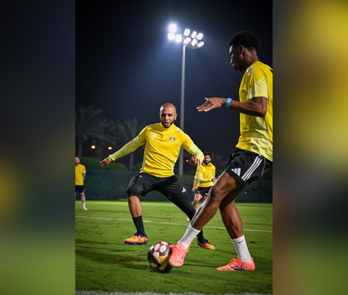 Al Gharafa's Yacine Brahimi (left) in action with a teammate. 