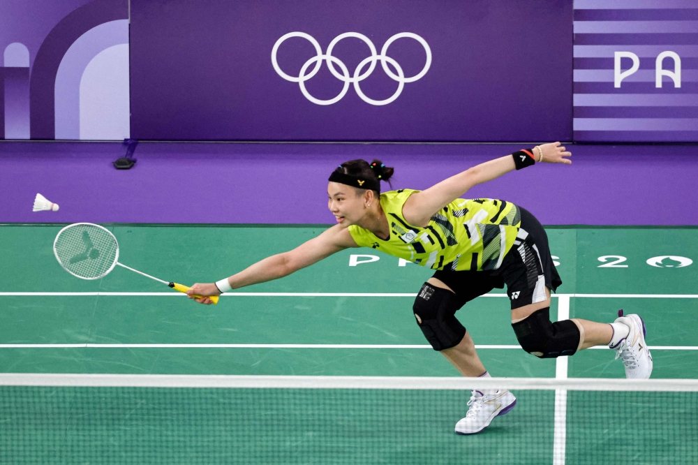 (Files) Taiwan's Tai Tzu-ying plays a shot to Belgium's Lianne Tan in the women's singles badminton group stage match during the Paris 2024 Olympic Games in July 2024. (Photo by David Gray / AFP)
