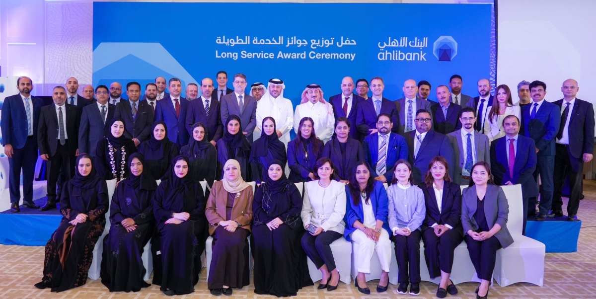 Ahlibank officials with its long-serving employees at the award ceremony.