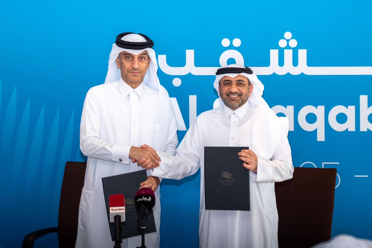 QIIB Deputy CEO Jamal Abdullah Al-Jamal and Al Shaqab Deputy CEO Khalid Al Hitmi pose for a photo after signing the agreement. 