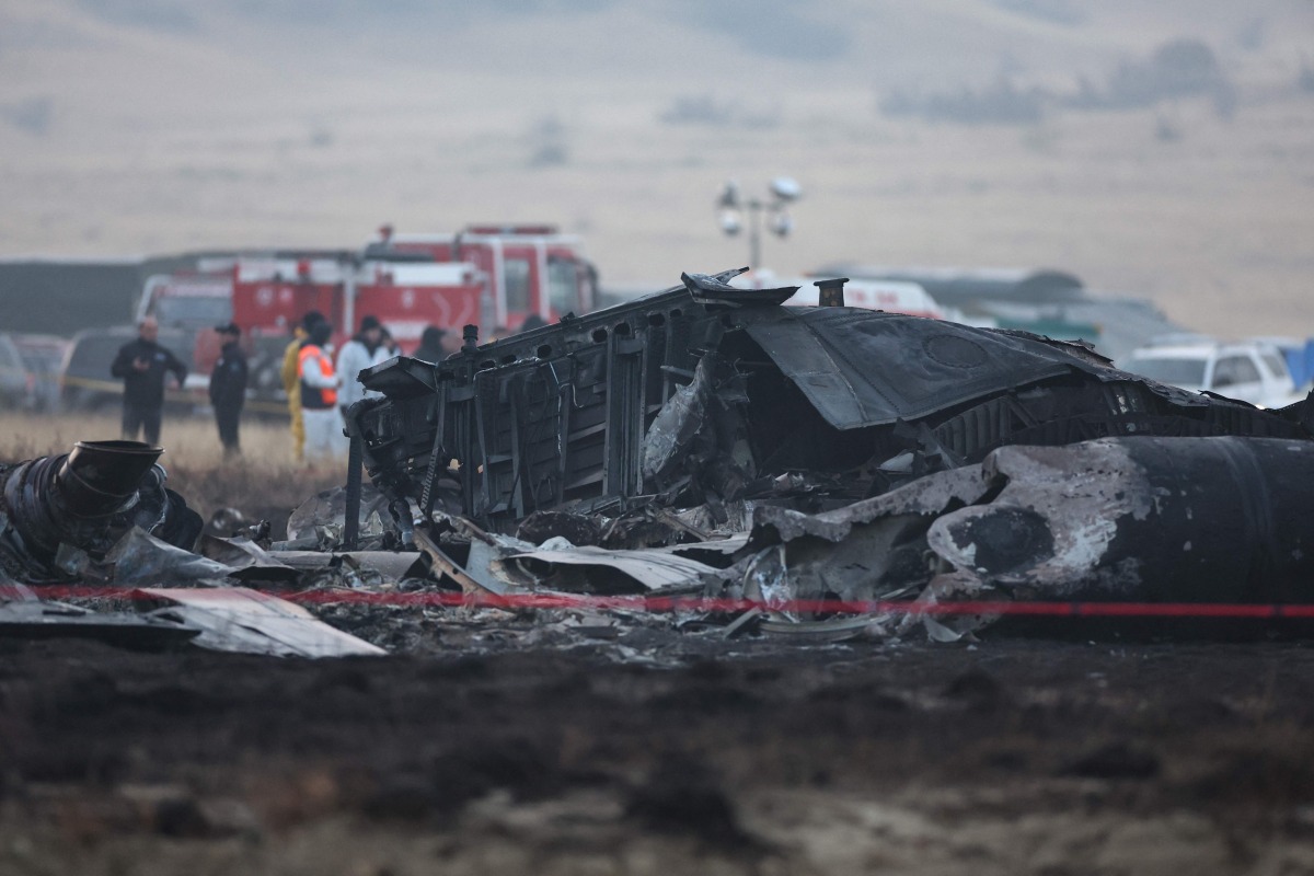 Wreckage is seen at the crash site of the Turkish C-130 military cargo plane in the Sighnaghi area at the Georgia-Azerbaijan border on November 12, 2025. Photo by Giorgi ARJEVANIDZE / AFP