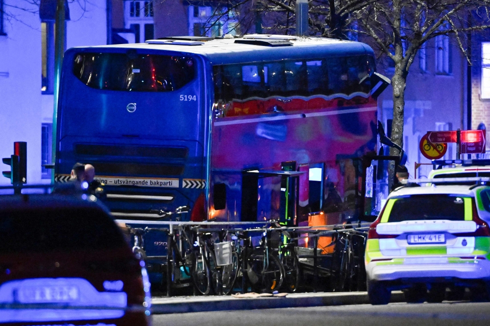 Picture taken on November 14, 2025 shows first responders working at the scene where a bus crashed into people in Stockholm, Sweden. Several people were killed and others injured when a bus rammed into a bus stop queue in central Stockholm during the afternoon rush hour Friday, police said. Photo by Henrik Montgomery/ TT News Agency / AFP