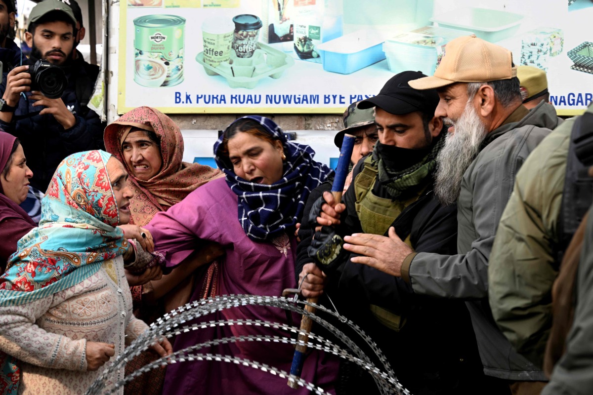 Relatives of the victims who died in an accidental blast at Nowgam police station, scuffle with security personnel whilst demanding bodies of the deceased, on the outskirts of Srinagar, on November 15, 2025. (Photo by Tauseef MUSTAFA / AFP)
 
