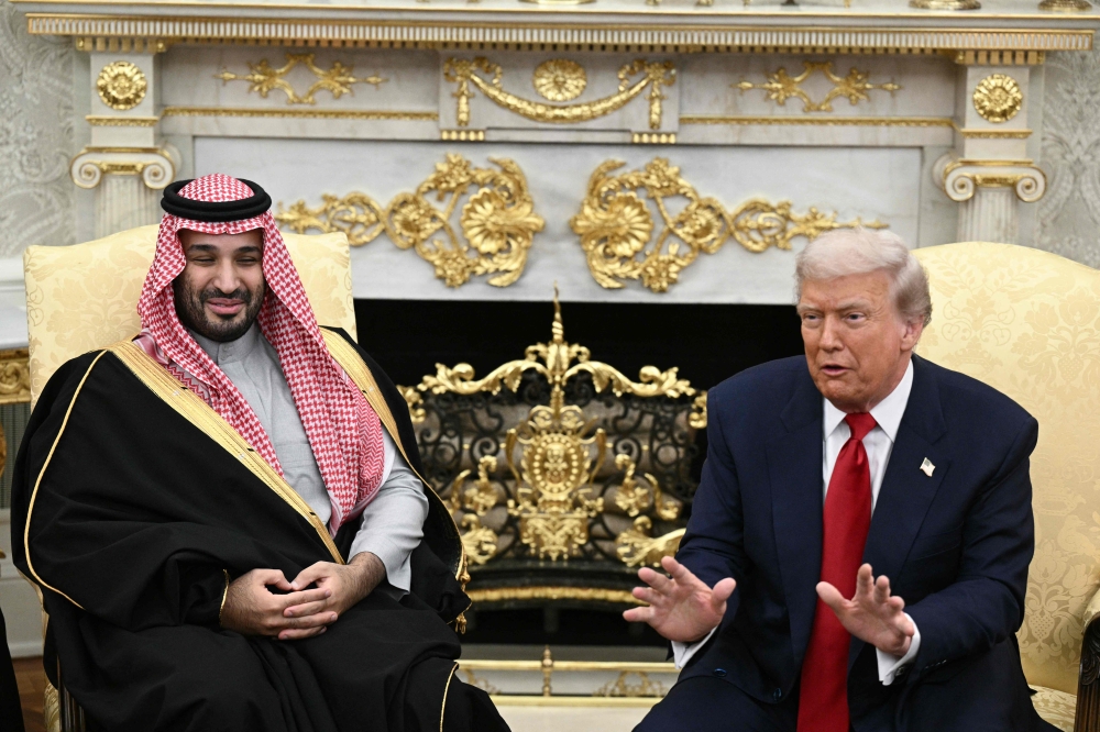 US President Donald Trump meets with Crown Prince and Prime Minister of the Kingdom of Saudi Arabia Mohammed bin Salman in the Oval Office of the White House in Washington, DC on November 18, 2025. Saudi Crown Prince Mohammed bin Salman arrived at the White House to fanfare and a jet flyover Tuesday, in his first visit to the United States since the 2018 murder of journalist Jamal Khashoggi. Photo by Brendan Smialowski / AFP