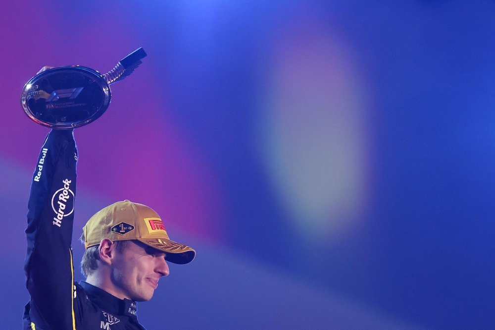 Race winner Max Verstappen of the Netherlands and Oracle Red Bull Racing lifts his trophy on the podium during the F1 Grand Prix of Las Vegas at Las Vegas Strip Circuit on November 22, 2025 in Las Vegas, Nevada. Hector Vivas/Getty Images/AFP