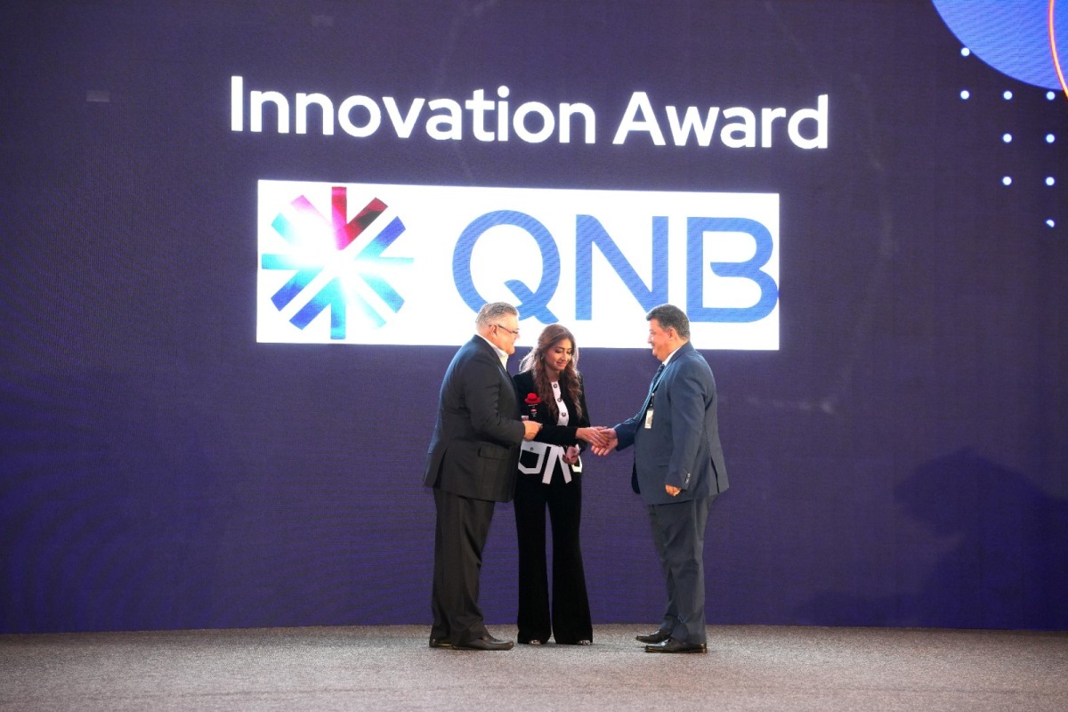 A QNB official receiving the award at Red Hat Summit 2025.