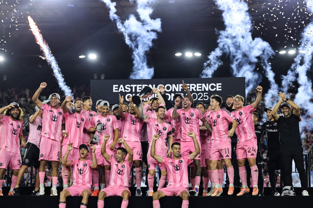 Lionel Messi #10 of Inter Miami CF and teammates lift the Champion's trophy after winning the the Audi 2025 MLS Cup western conference final match between Inter Miami CF and New York City FC at Chase Stadium on November 29, 2025 in Fort Lauderdale, Florida. Carmen Mandato/Getty Images/AFP