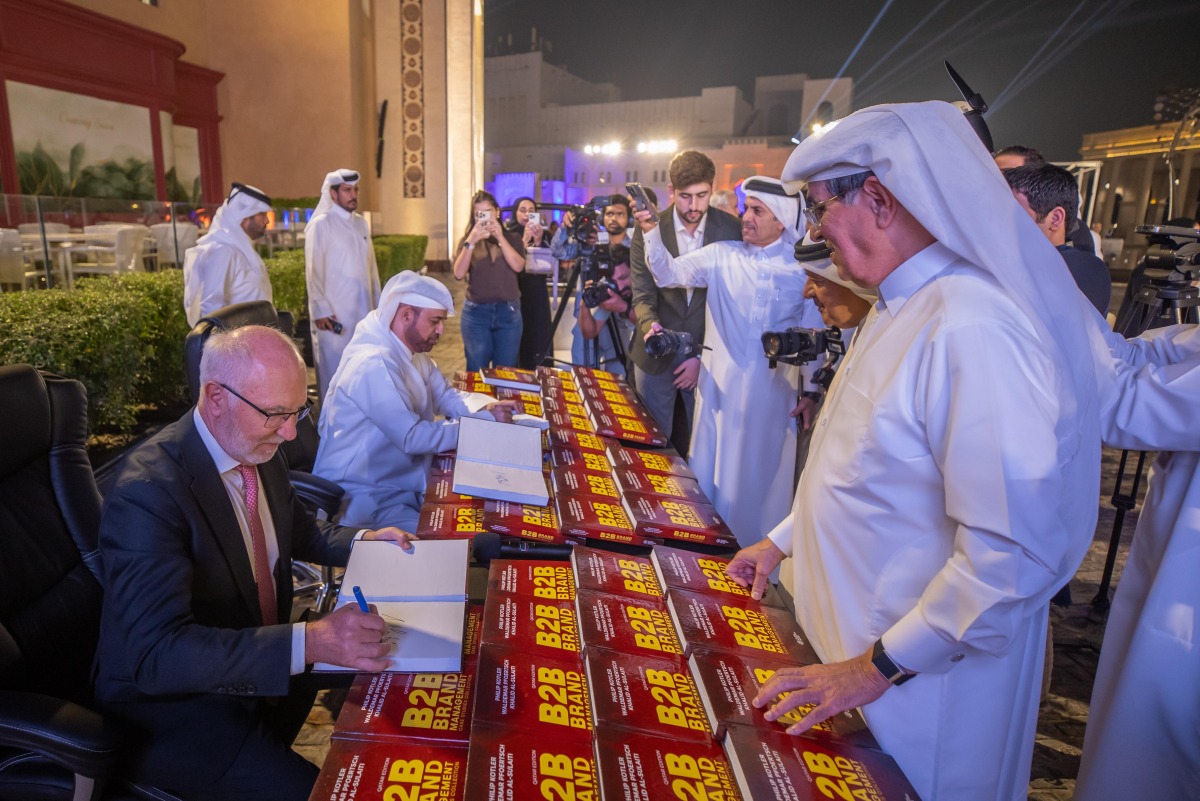 General Manager of Katara Prof. Dr. Khalid bin Ibrahim Al Sulaiti and Professor Waldemar Pfoertsch sign copies after the launch event. 