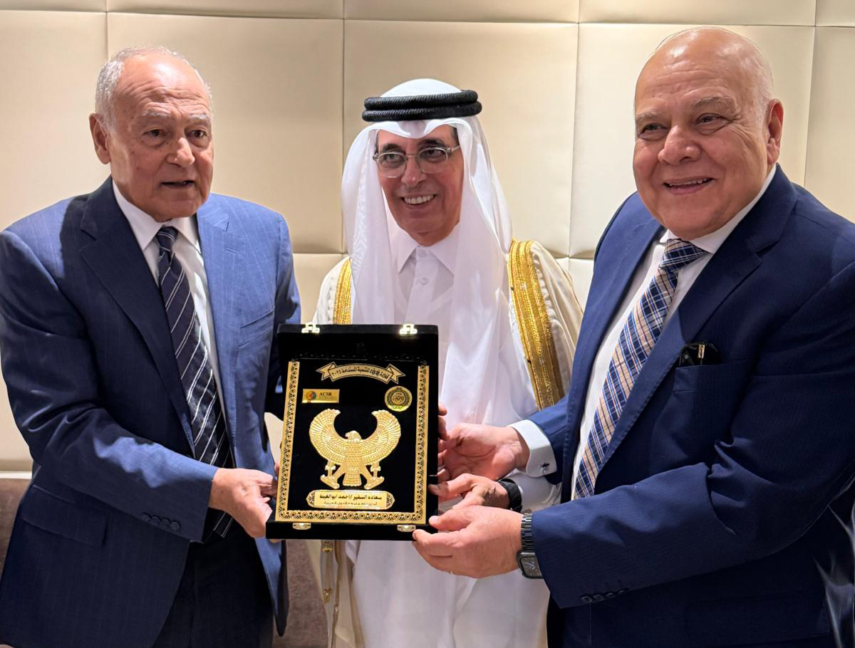 Secretary-general of the Arab League Ahmed Aboul Gheit (left) along with another official honouring Minister of State and President of Qatar National Library H E Dr. Hamad bin Abdulaziz Al-Kawari (centre) during the forum.