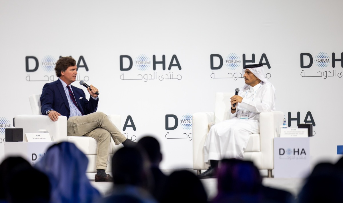 Prime Minister and Minister of Foreign Affairs H E Sheikh Mohammed bin Abdulrahman bin Jassim Al-Thani in discussion with Tucker Carlson at the Doha Forum yesterday.