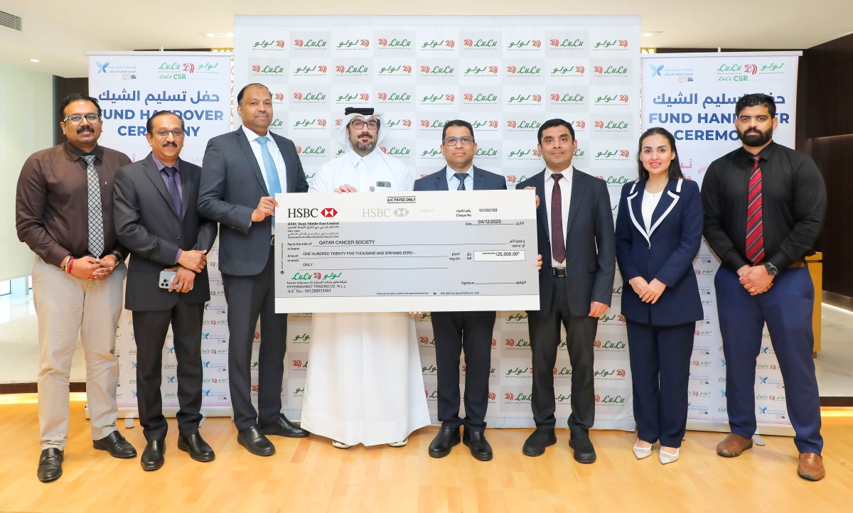 LuLu Hypermarket Qatar and Qatar Cancer Society officials during the cheque handover ceremony.