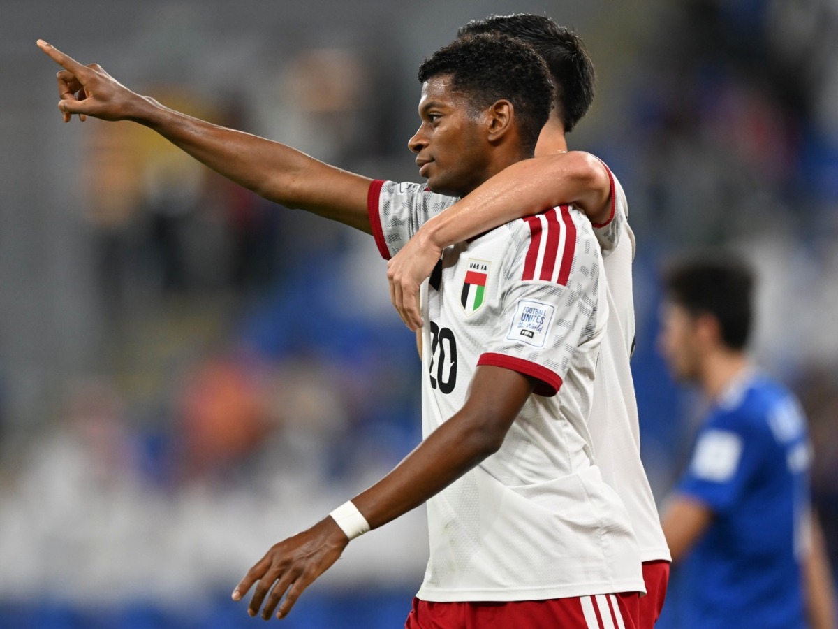 Yahya Al Ghassani celebrates with a teammate.