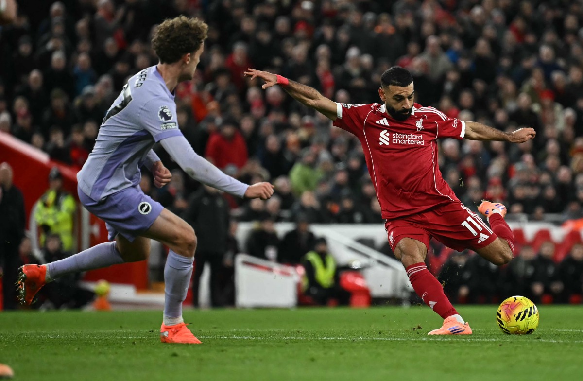 Liverpool’s Mohamed Salah attempts to shoot and score against Brighton and Hove Albion at Anfield yesterday.