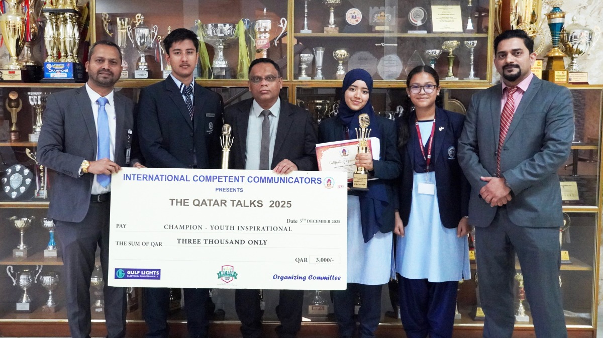 IIS officials and participating students with trophy and certificate.   