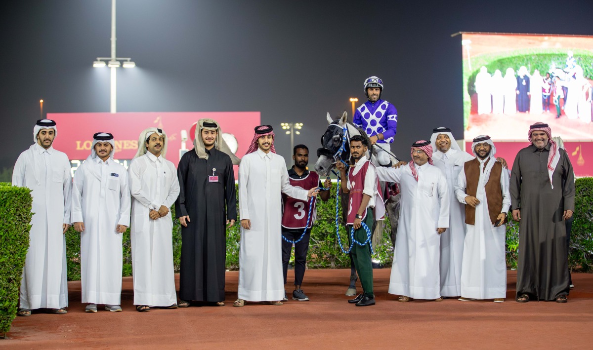 The connections of Naseeb Zakhir celebrate after the Osama Omer Al-Dafea-owned grey colt won the Zekreet Cup. PICTURES: JUHAIM/QREC