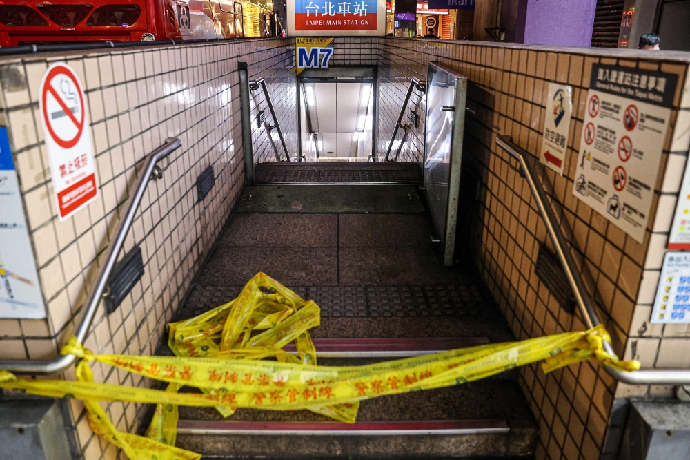 This picture taken and released by Taiwan's Central News Agency (CNA) on December 19, 2025 shows one of the entrances to Taipei Main Station being cordoned off. (Photo by Cheng Ching-Yuan / Central News Agency (CNA) / AFP) 