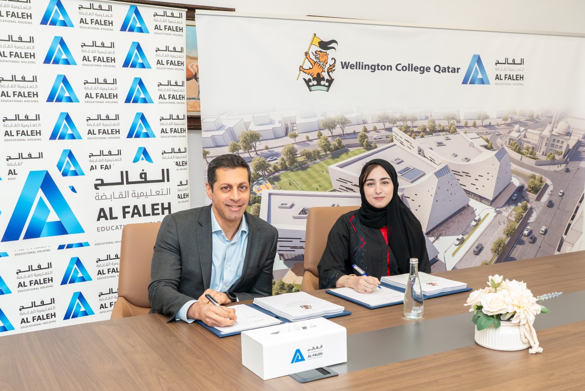 CEO of Al Faleh Educational Holding Sheikha Anwar Al Thani and Managing Director of Wellington College International Paresh Thakrar signing the agreement.