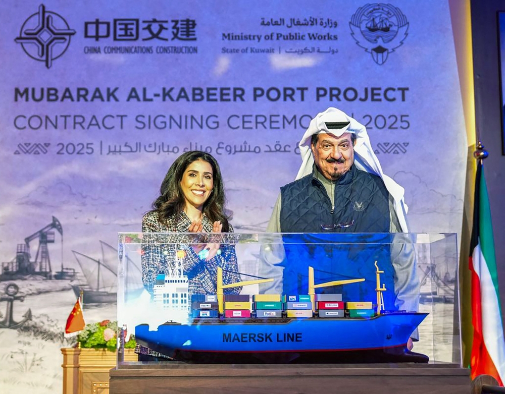 This handout picture released by the Kuwaiti news agency KUNA shows Kuwait's Prime Minister HH Sheikh Ahmad Abdullah al-Ahmad al-Sabah (R) and Kuwaiti minister of public works Nora al-Mashaan attending the contract signing ceremony between Kuwait and the China State Construction and Communications Corporation Limited on December 22, 2025. (Photo by KUNA / AFP) 