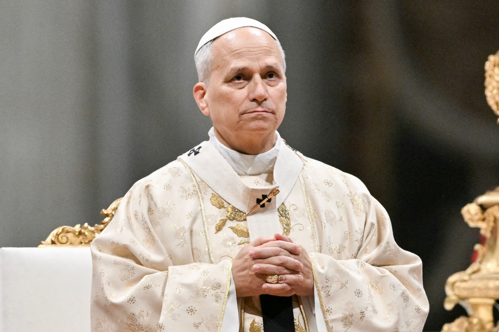 Pope Leo XIV performs the Christmas mass at St Peter's Basilica in the Vatican on December 25, 2025. (Photo by Tiziana Fabi / AFP)