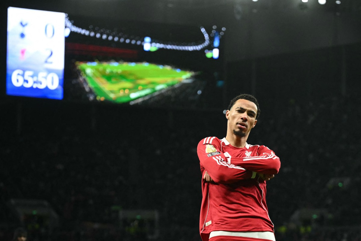 Liverpool's French striker #22 Hugo Ekitike strikes a pose as he celebrates scoring their second goal for 0-2 during the English Premier League football match between Tottenham Hotspur and Liverpool at the Tottenham Hotspur Stadium in London, on December 20, 2025. (Photo by JUSTIN TALLIS / AFP)