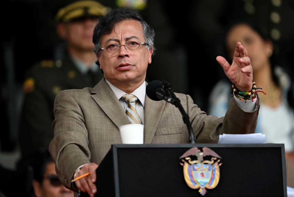 Colombia's President Gustavo Petro delivers a speech during the commemoration of the 134th anniversary of the National Police and the promotion of officers at the General Santander Police Academy in Bogota on November 13, 2025. (Photo by Raul Arboleda/ AFP)
