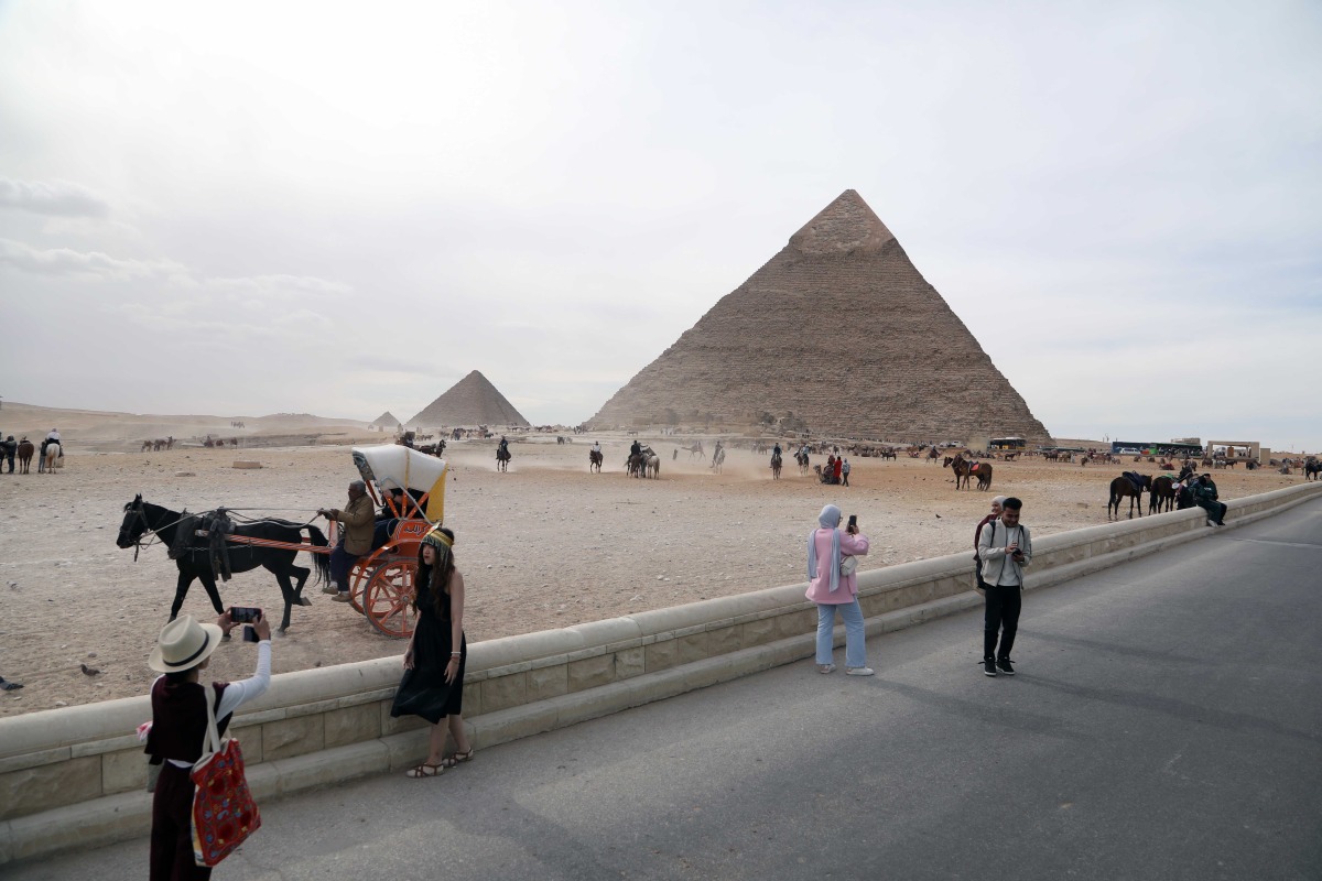 For representational purposes only. This photo taken on Jan. 1, 2026 shows tourists visiting the Pyramids of Giza in Egypt. (Xinhua/Ahmed Gomaa)