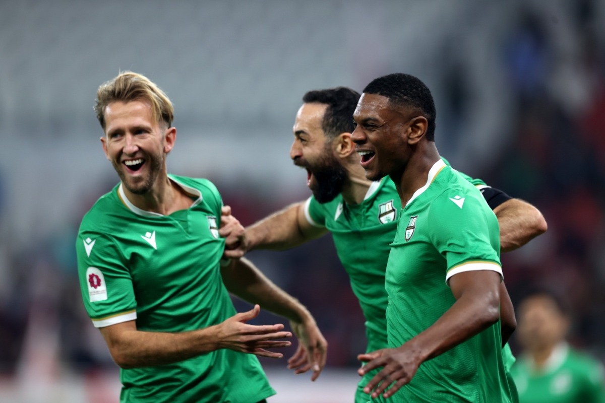 Al Ahli's Sekou Yansane (right) celebrates with teammates.