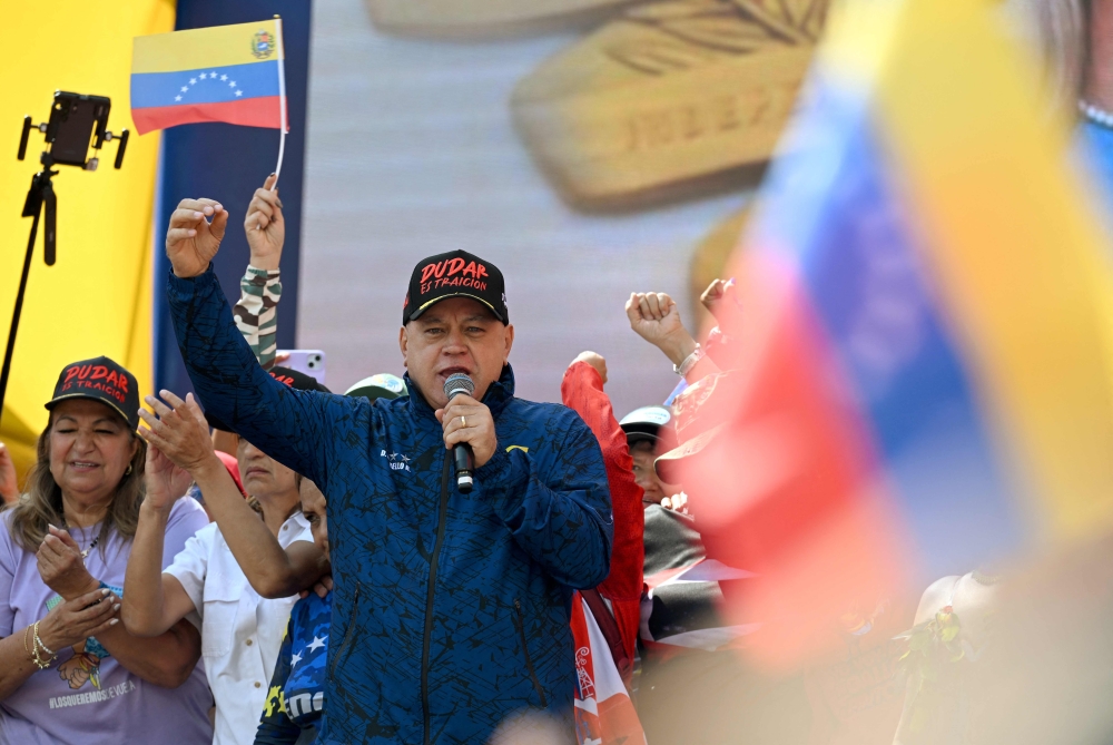 Venezuela's Minister of Interior Diosdado Cabello delivers a speech in support of ousted Venezuela's President Nicolas Maduro and his wife Cilia Flores in Caracas on January 6, 2026. (Photo by Ronaldo Schemidt / AFP)