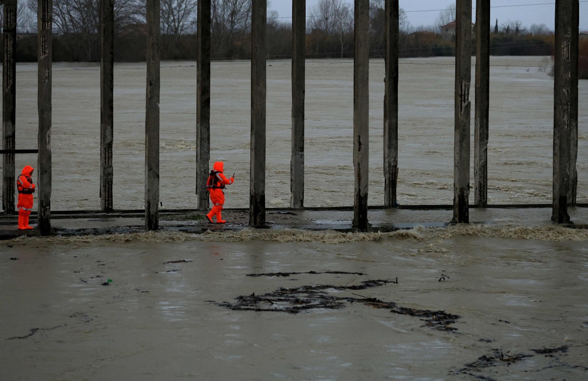 Members of the Civil Emergencies services monitor the Vjosa River in the village of Novosele, near Vlore on January 8, 2026. Photo by Adnan Beci / AFP