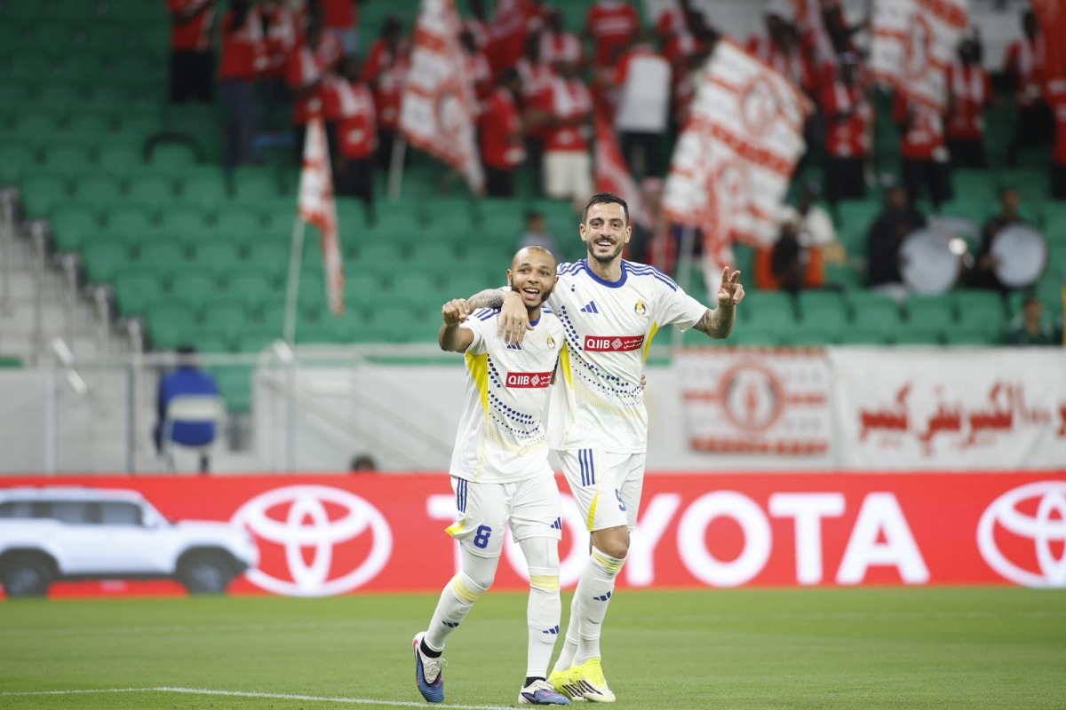 Al Gharafa's Joselu (right) celebrates with teammate Yacine Brahimi after scoring a goal.