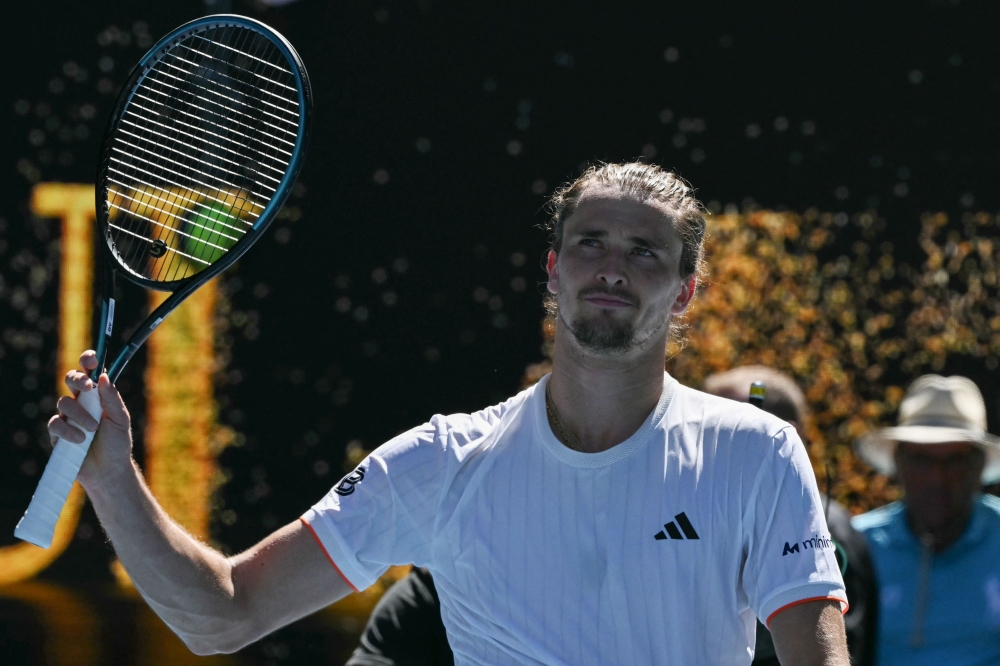 Germany's Alexander Zverev celebrates after his victory against Canada's Gabriel Diallo during their men's singles match on day one of the Australian Open tennis tournament in Melbourne on January 18, 2026. (Photo by Paul Crock / AFP)