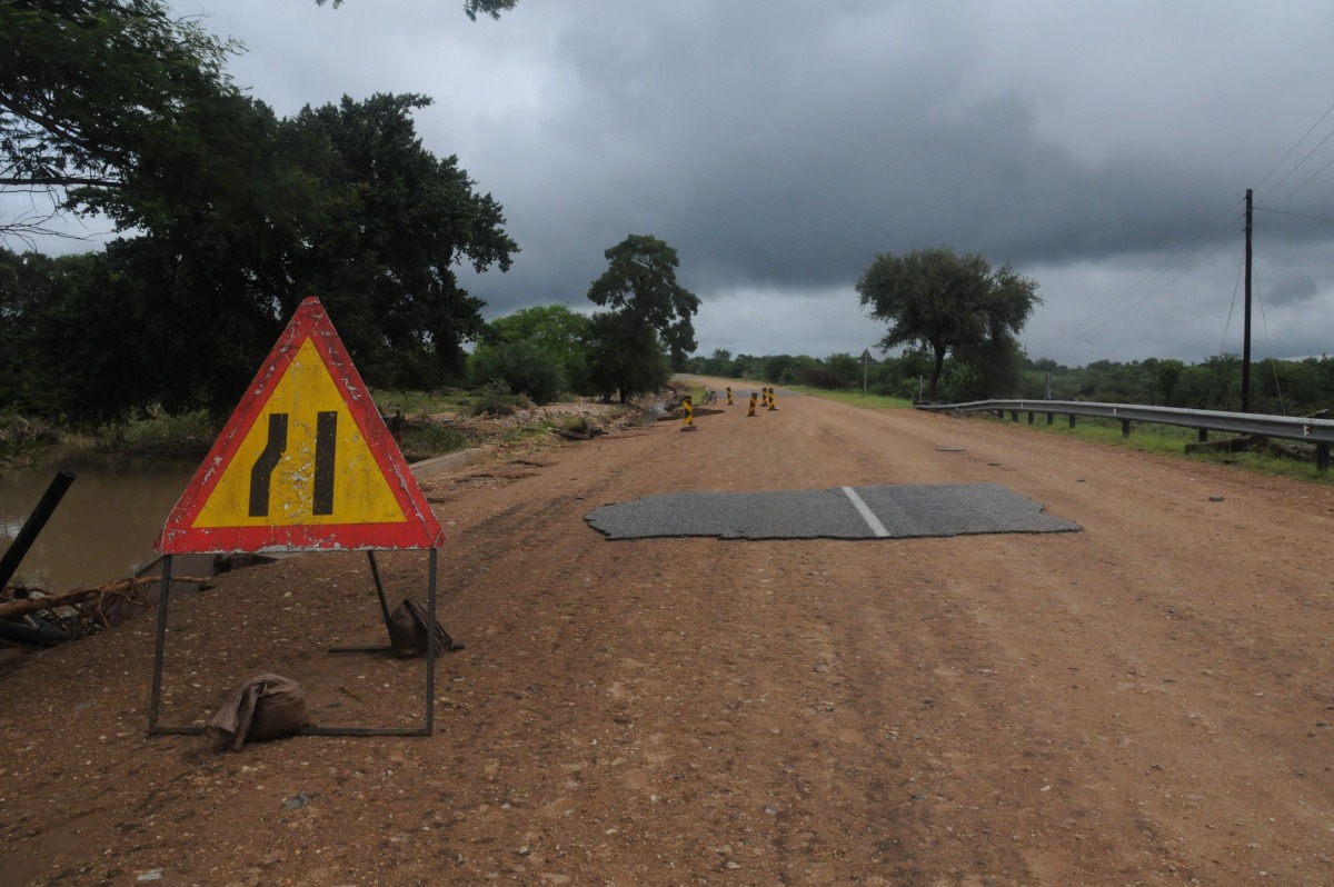 A general view of a damaged road on the way from Giyani to Mbaula on January 17, 2026 following heavy rains over much of the Limpopo Province, South Africa (Photo by LUCAS LEDWABA / AFP)
