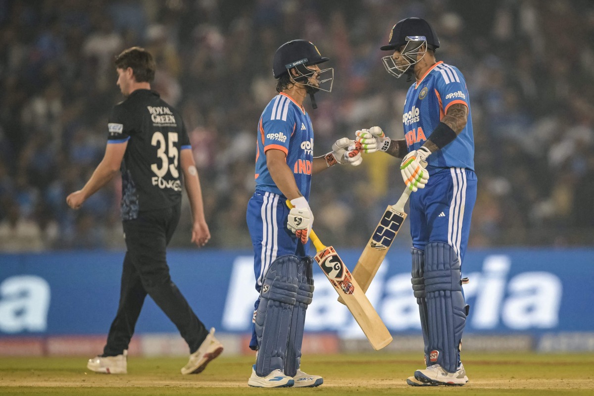 India's Ishan Kishan and Suryakumar Yadav bump their fists during the second Twenty20 international cricket match between India and New Zealand at the Shaheed Veer Narayan Singh International cricket Stadium in Raipur on January 23, 2026. (Photo by Dibyangshu SARKAR / AFP)