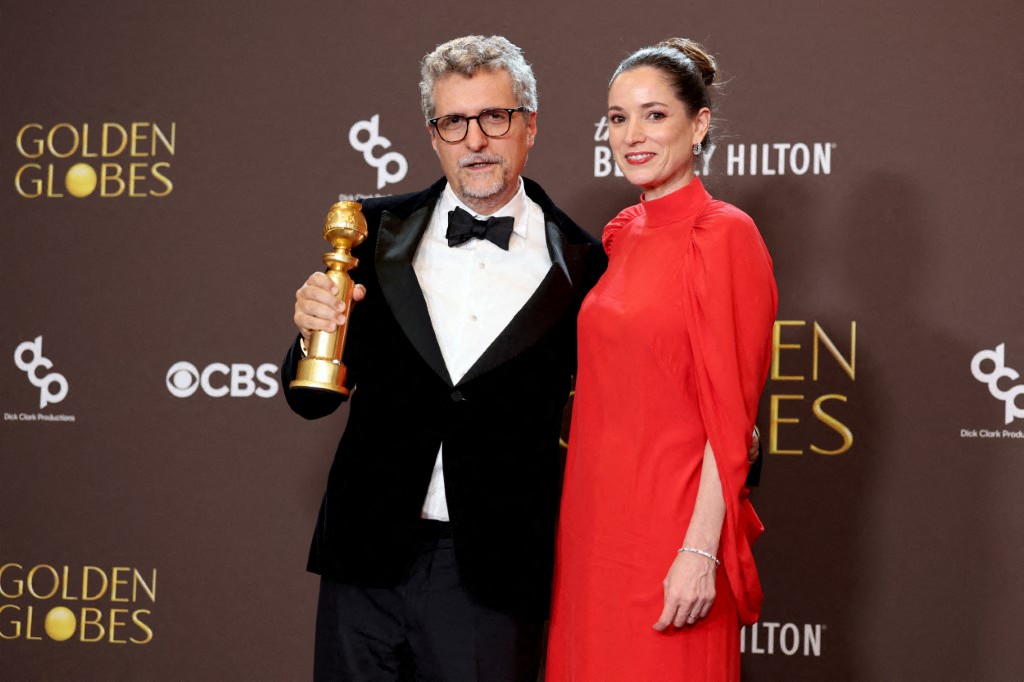 (L-R) Kleber Mendonça Filho and Emilie Lesclaux, winners of the Best Motion Picture – Non-English Language Award for 