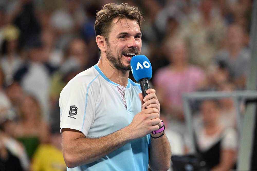 Switzerland's Stan Wawrinka gives an interview after losing to USA's Taylor Fritz in their men's singles match in Melbourne on January 24, 2026. (Photo by Paul Crock / AFP)