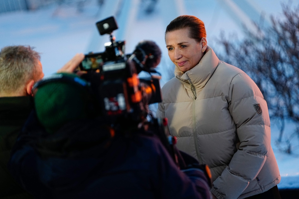Denmark's Prime Minister Mette Frederiksen talks to the press during sunset in Nuuk, Greenland, on January 23, 2026. (Photo by Mads Claus Rasmussen / Ritzau Scanpix / AFP) 