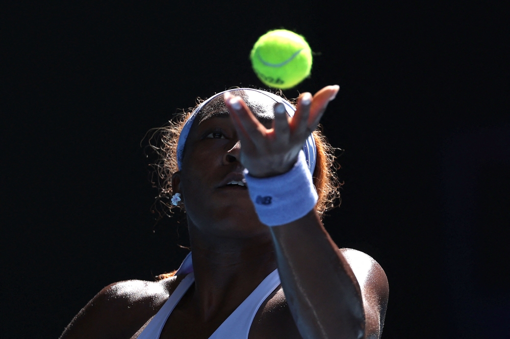 USA's Coco Gauff serves to Czech Republic's Karolina Muchova during their women's singles match on day eight of the Australian Open tennis tournament in Melbourne on January 25, 2026. (Photo by Martin Keep / AFP)