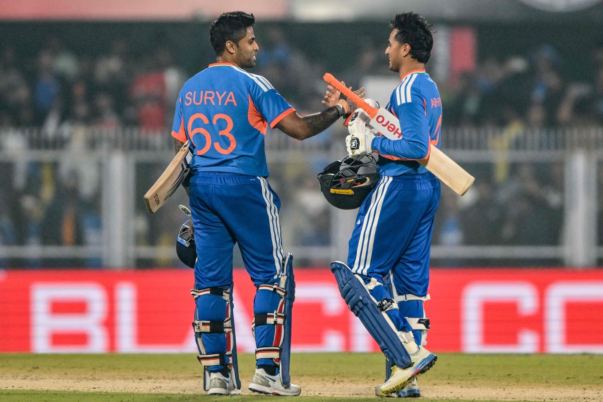 India's Abhishek Sharma and captain Suryakumar Yadav celebrate their team's win at the end of the third Twenty20 between India and New Zealand at Guwahati on January 25, 2026. (Photo by Biju BORO / AFP) 